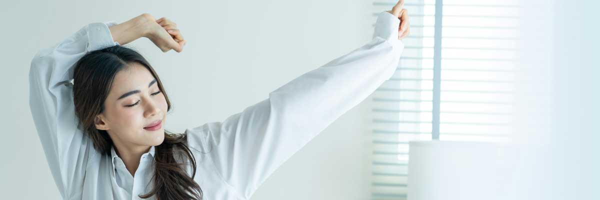 woman stretching waking up