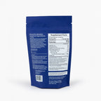 Back side of blue IN DREAM supplement package with nutritional information on a white background
