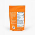 Back side of orange IN MOTION supplement package with nutritional information on a white background