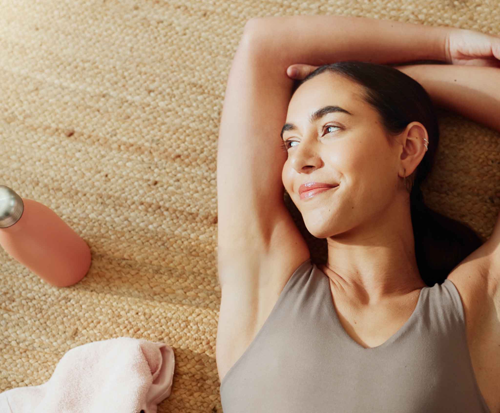woman stretching on mat