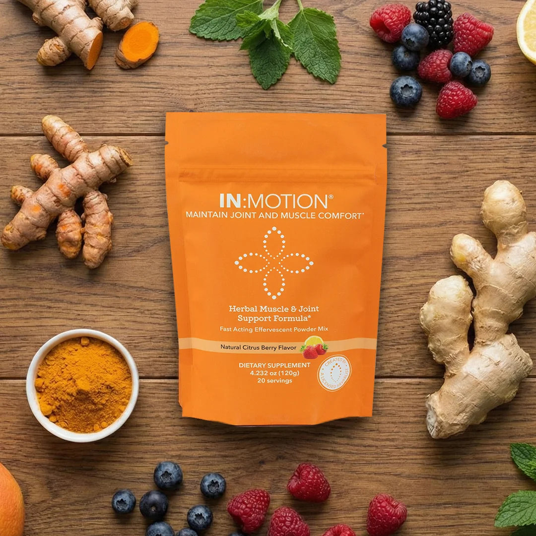 IN MOTION supplement package on a wooden surface with turmeric, ginger, and berries.